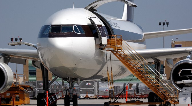 A UPS cargo plane being serviced at an airport.