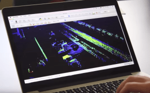 Davis presents data that shows the LiDAR-equipped sedan moving along a roadway. (Photo by Micheal Foley, MnDOT)
