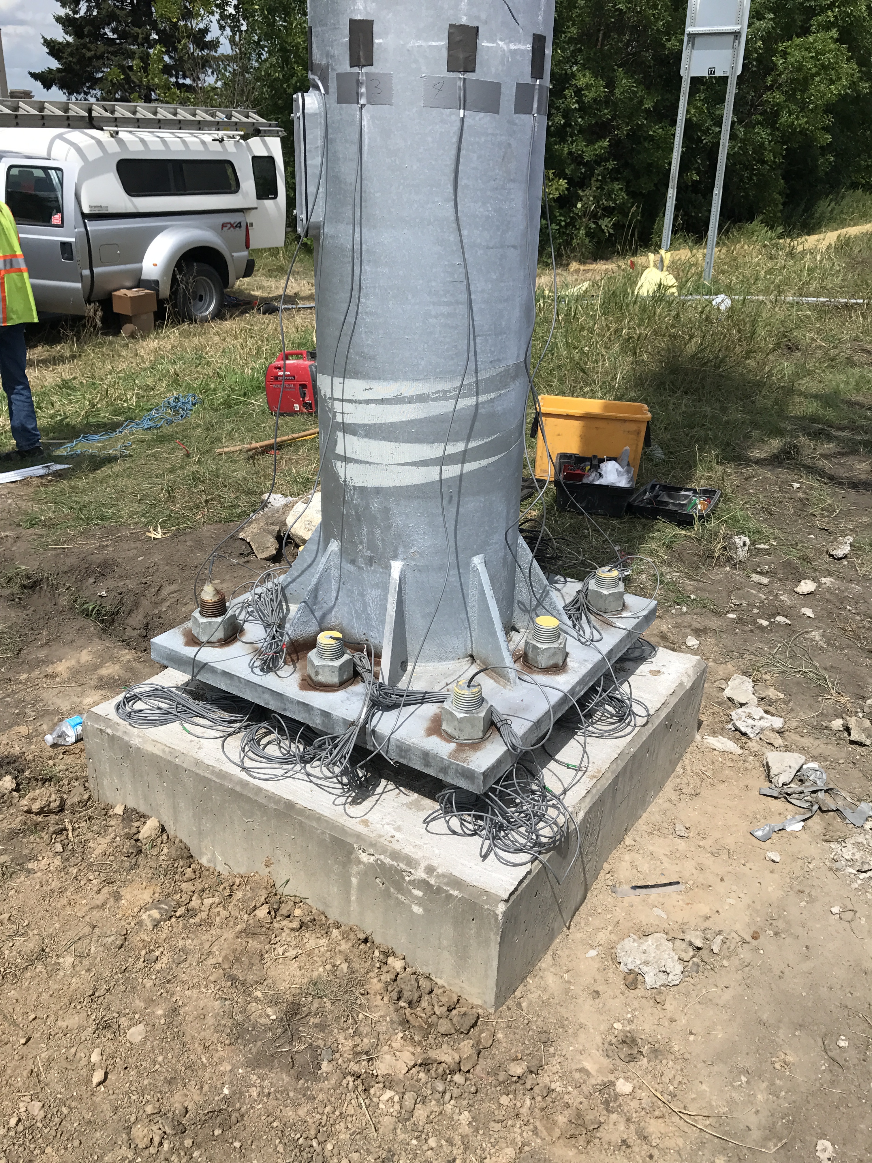 Base of an overhead sign that shows large bolts
