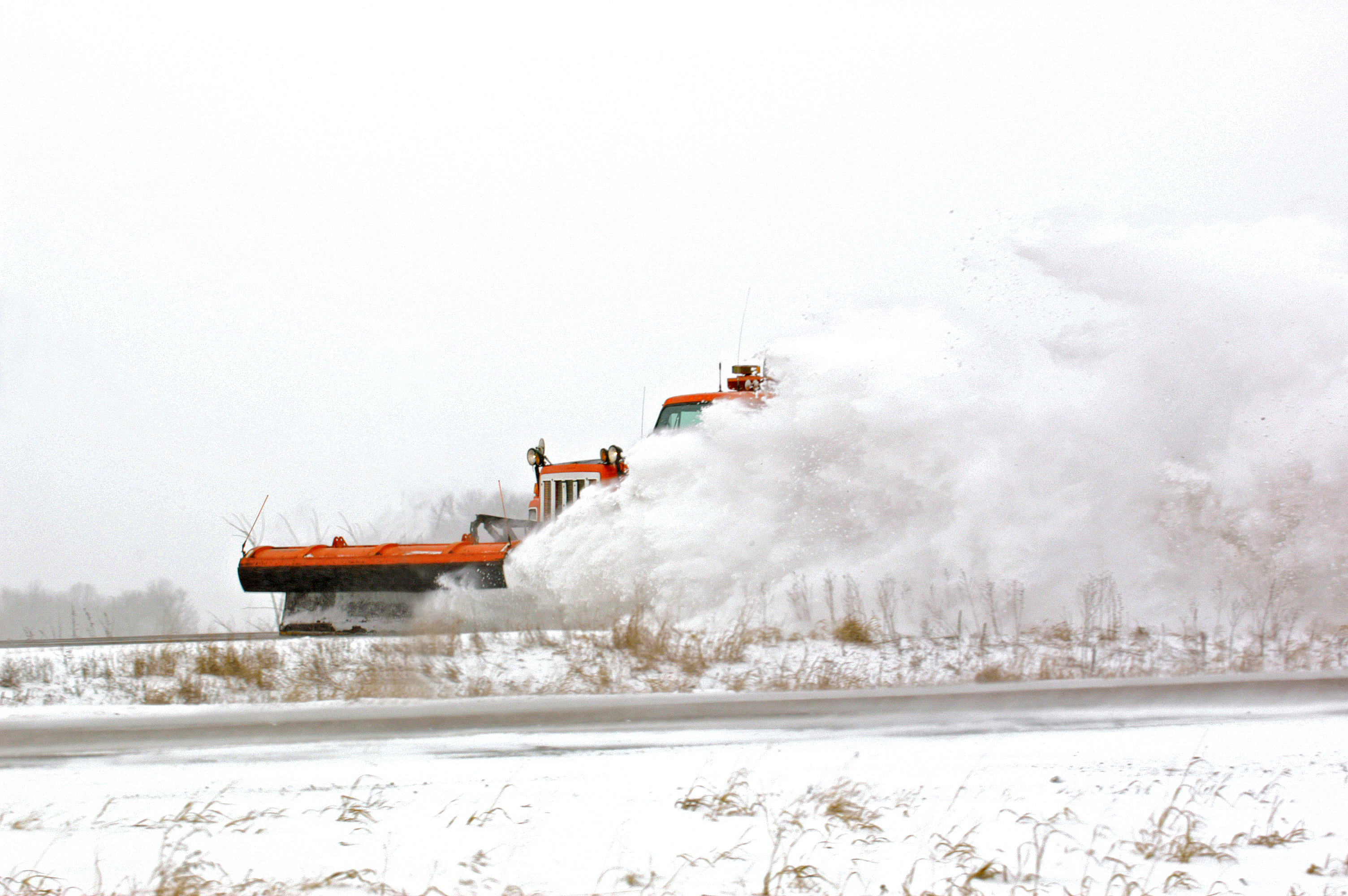 Snowplow on a snowy highway