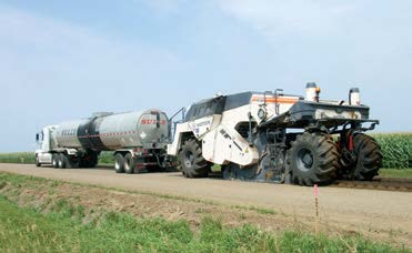 a tanker truck connected to a reclaimer