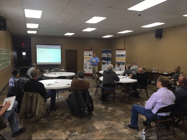 People discuss the snow fence program in St. James.