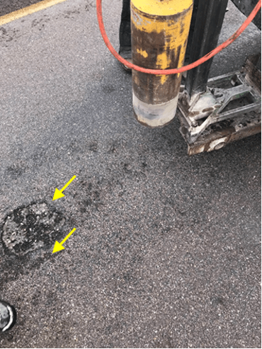 Seal coat damage on pavement.