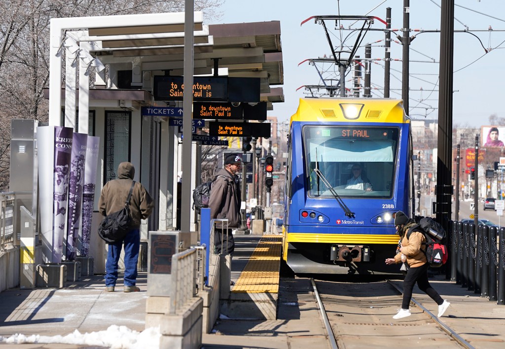 Train pulling up to platform.
