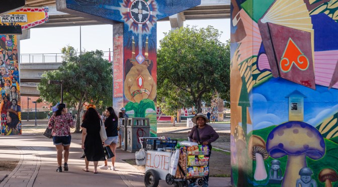 A large bridge foundation in Chicano Park, San Diego, with eye-catching artwork on the pylons.