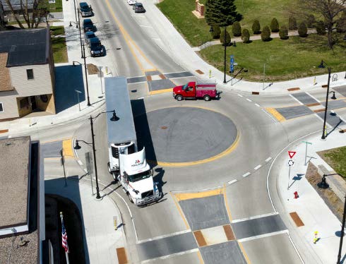 Semi-truck traverses mini-roundabout